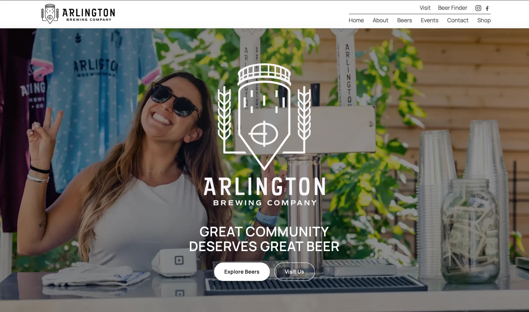 The Arlington Brewing Company homepage: a full-bleed photo of a smiling bartender at the outdoor tap stand, overlaid with the white water-tower logo, the headline “Great community deserves great beer” and Explore Beers and Visit Us buttons, under a navigation bar with a Beer Finder link.